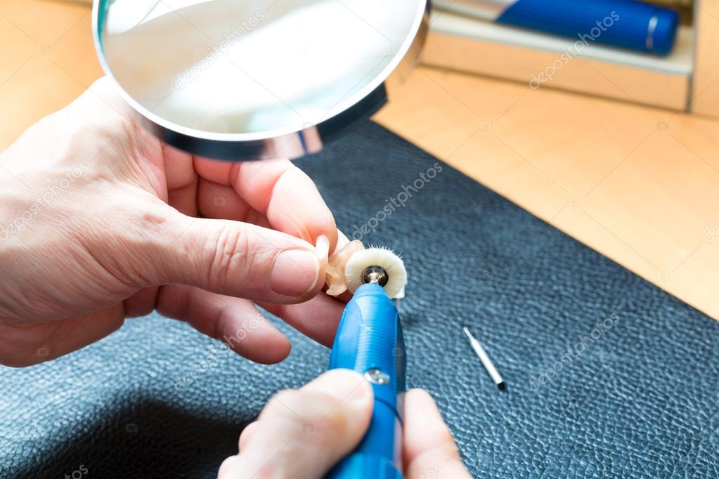 Acoustician working on a hearing aid