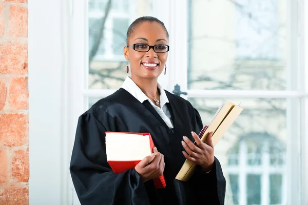 Lawyer in office with law book and Dossier — Stock Photo, Image