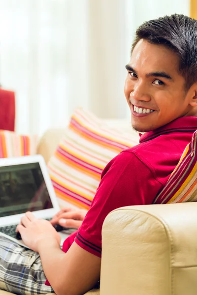 Asian man surfing the internet — Stock Photo, Image