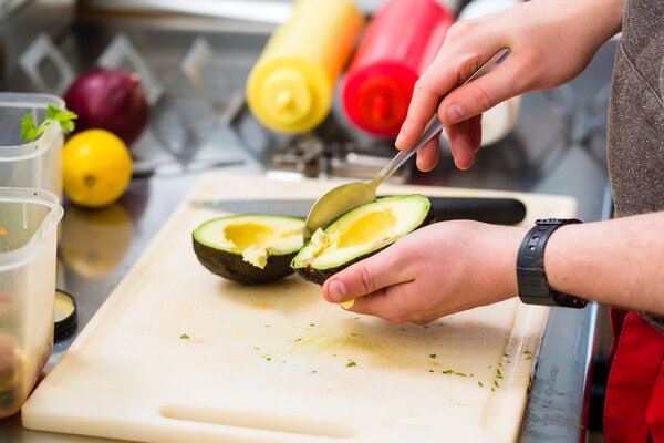 chef making hotdog in fast food snack bar