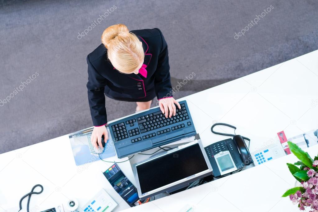 Hotel receptionist working at front office