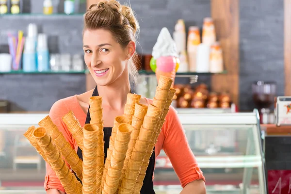 Female seller in Parlor with ice cream cone — Stok fotoğraf