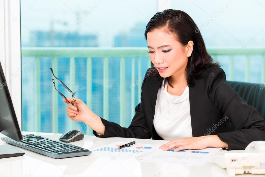 Asian Chinese businesswoman in office
