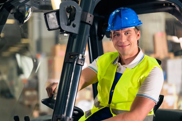 Forklift driver at warehouse of forwarding — Stock Photo, Image