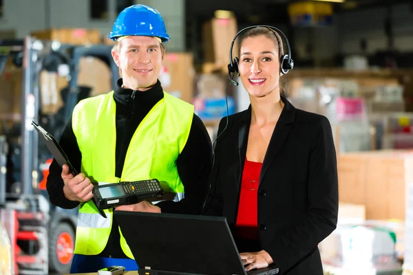 Coworkers at warehouse of forwarding company — Stock Photo, Image