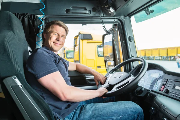 Forwarder or truck driver in drivers cap — Stock Photo, Image