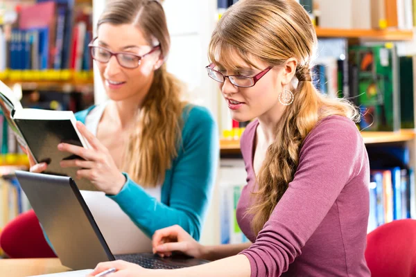 Students in library are a learning group Stock Picture