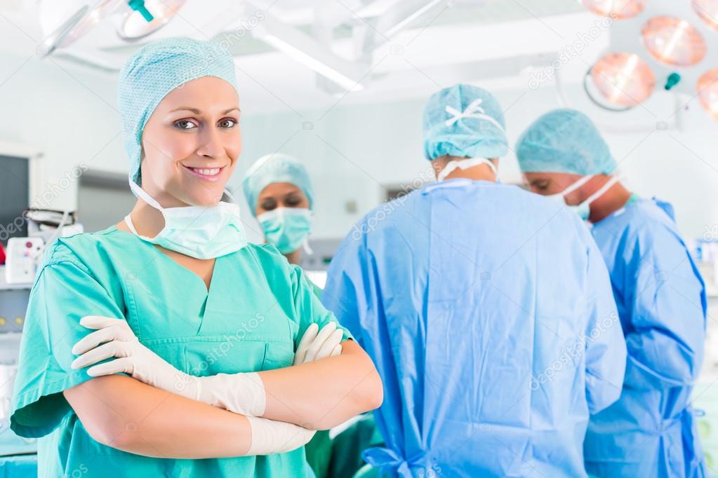 Surgeons operating patient in operation theater