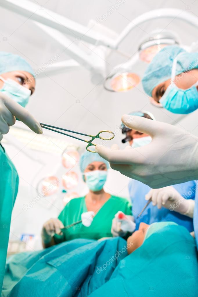 Surgeons in operating room in emergency