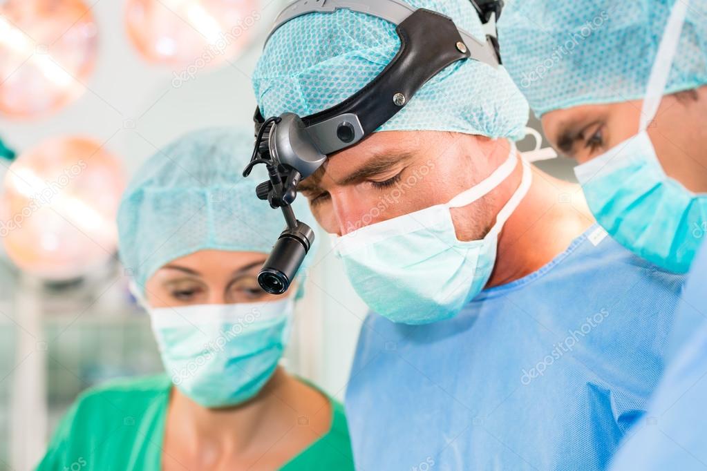 Surgeons in operating room in emergency