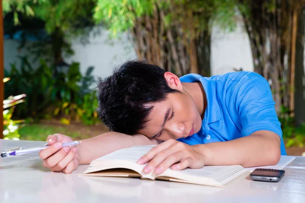 Joven Chino con tarea para la escuela —  Fotos de Stock