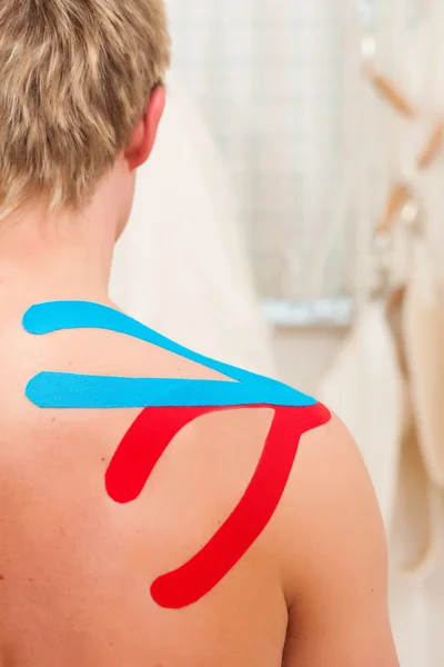 Patient at the physiotherapy with tape — Stock Photo, Image