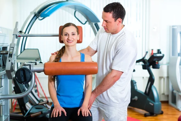 Patient at the physiotherapy doing physical therapy Stock Picture