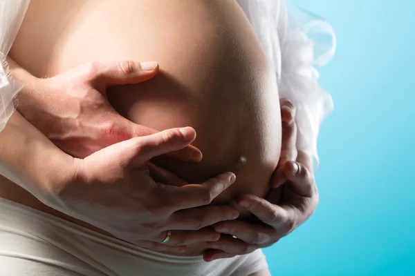 Pregnant woman touching her belly or  baby bump — Stock Photo, Image