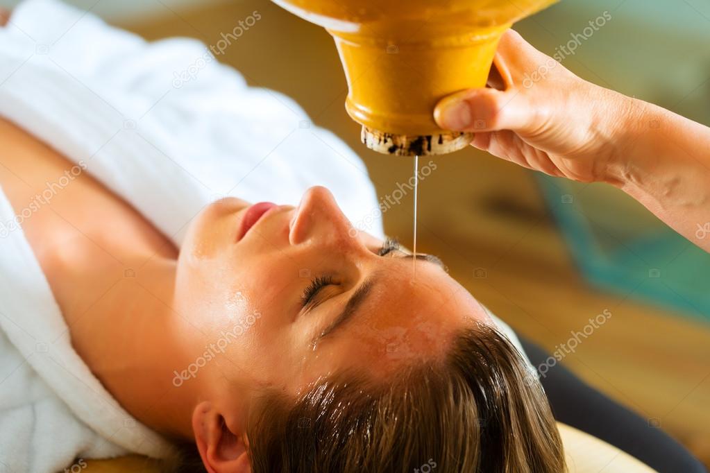 Woman enjoying a Ayurveda oil massage