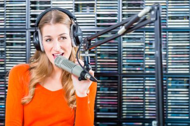 Female radio presenter in radio station on air clipart