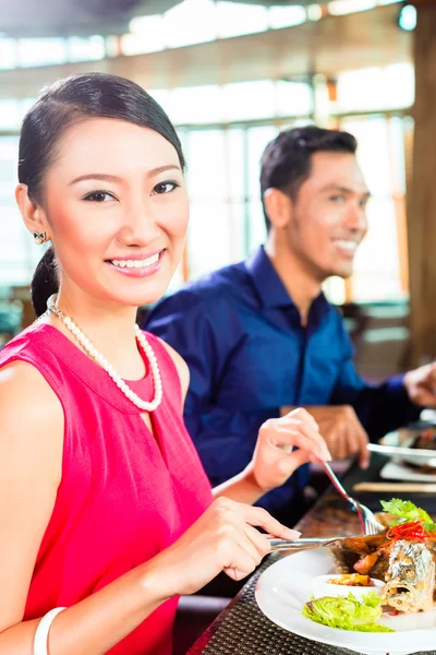 Asian people fine dining in restaurant — Stock Photo, Image
