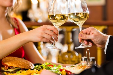 happy couple have a romantic date in restaura