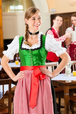 people in traditional Bavarian Tracht in restaurant or pub clipart