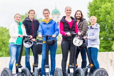 Tourists having Segway sightseeing clipart