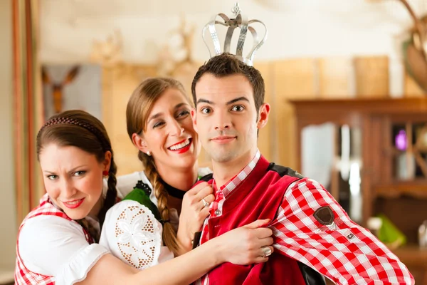 Young people in traditional Bavarian Tracht in restaurant or pub — 图库照片