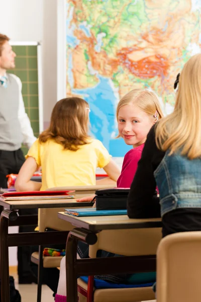 Education - Teacher with pupils in school teaching — Stock Photo, Image
