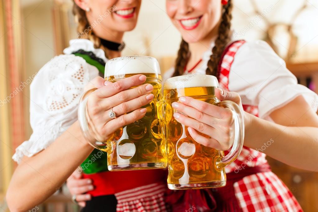 women in traditional Bavarian Tracht in restaurant or pub