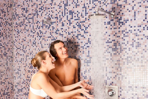 Young couple under experience shower — Stock Photo, Image