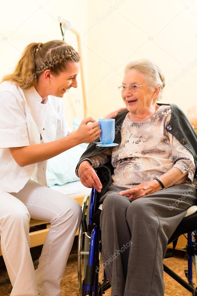 nurse and female senior in nursing home