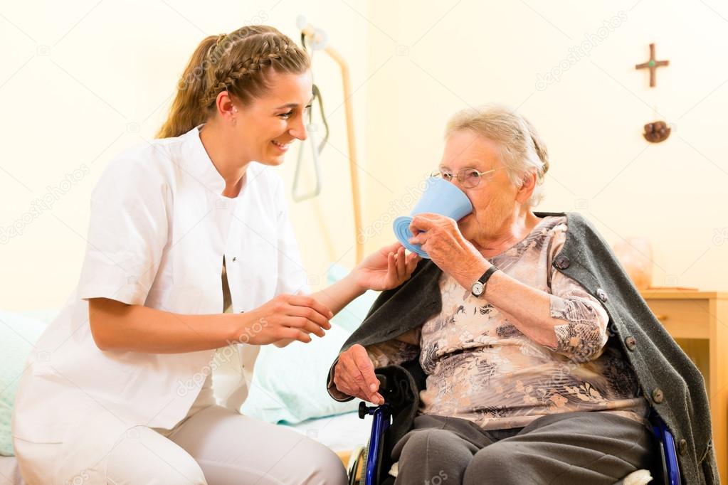 nurse and female senior in nursing home