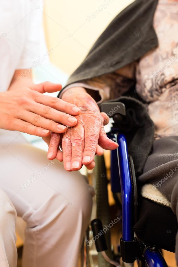 nurse and female senior in nursing home