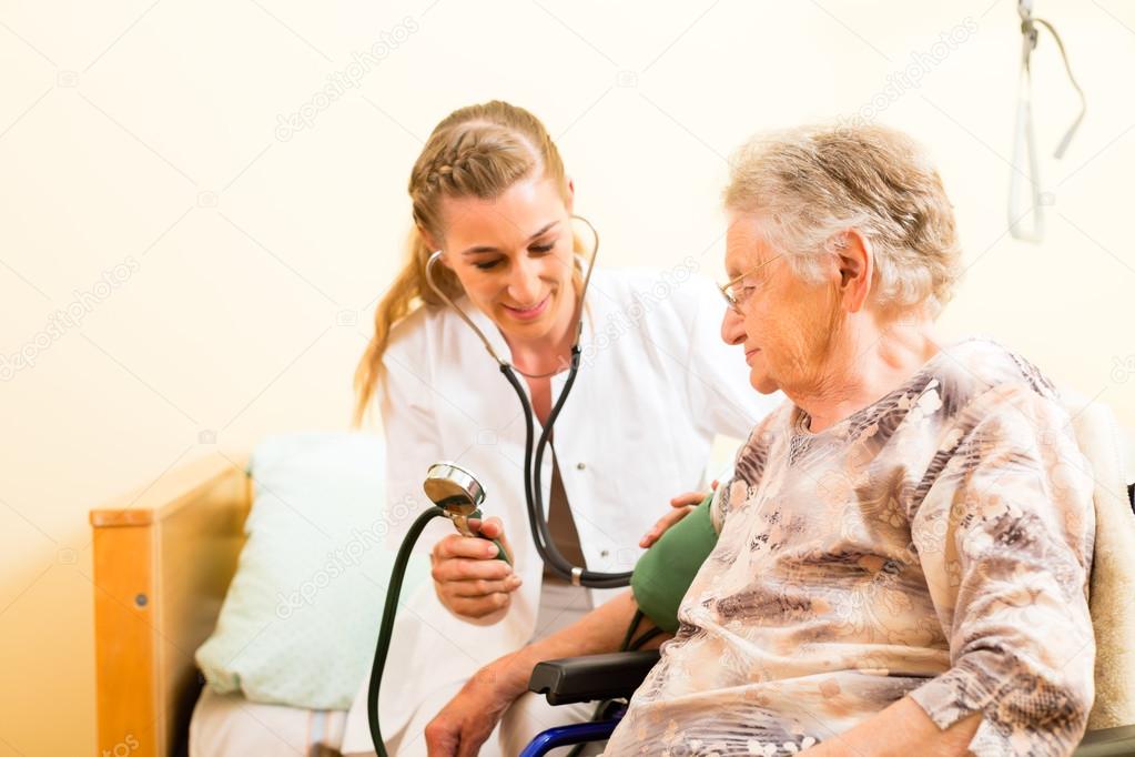 nurse and female senior in nursing home
