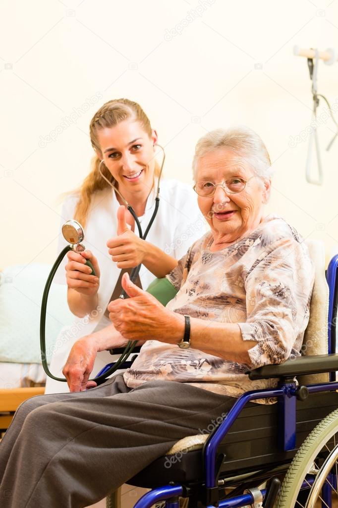 nurse and female senior in nursing home