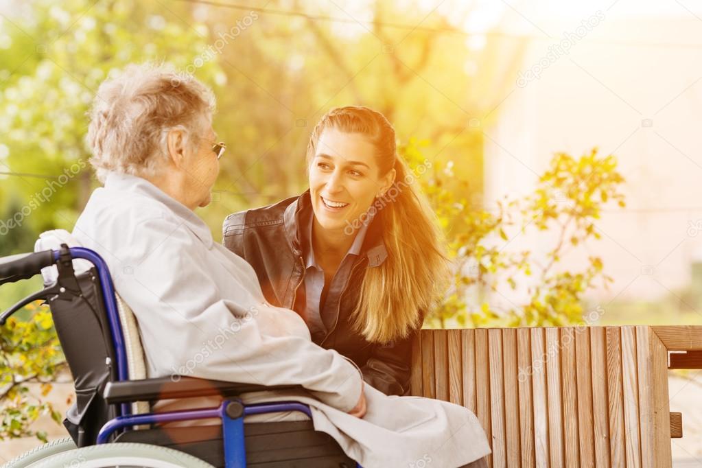 woman visiting grandmother in nursing home