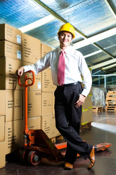 Young Man in warehouse he is a manager — Stock Photo, Image