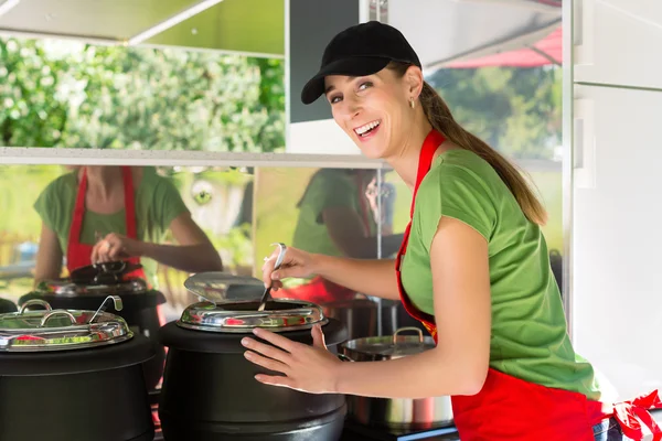 Young emloyee of an concession stand — Stock Photo, Image