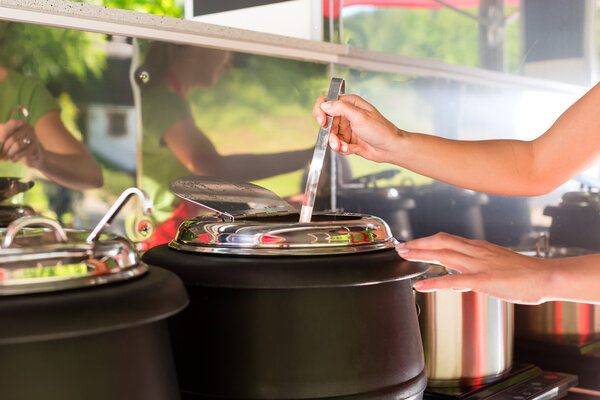 Young emloyee of an concession stand