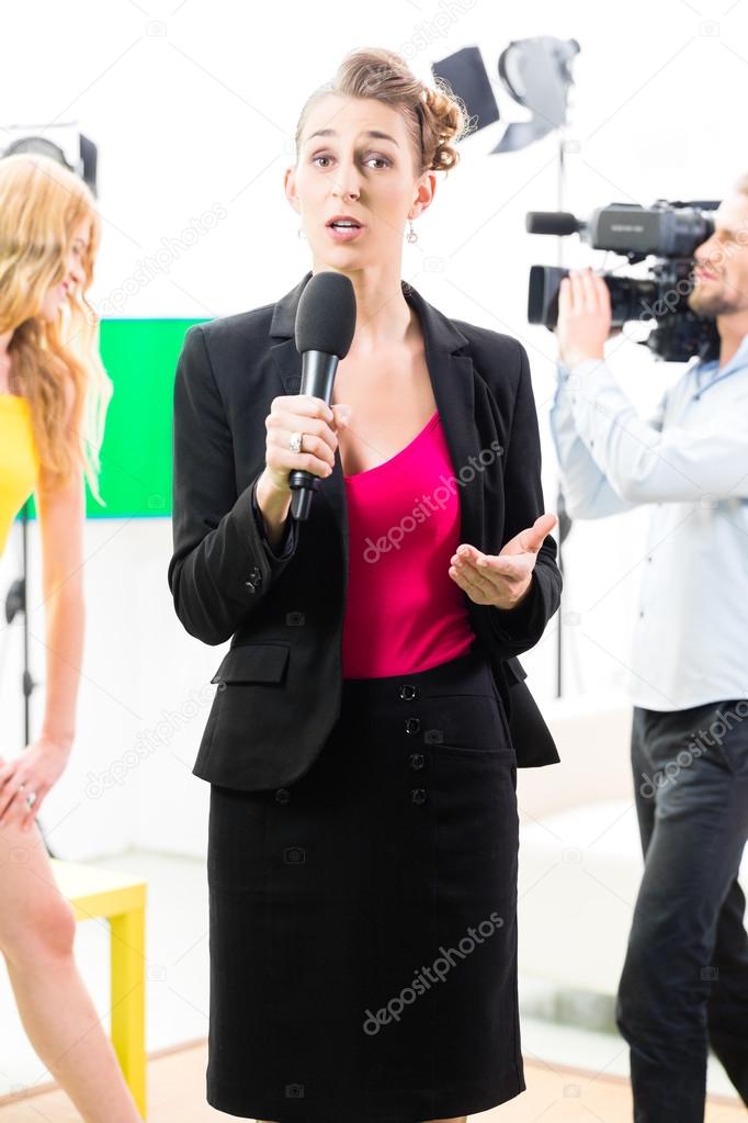 Reporter moderating an interview on film set