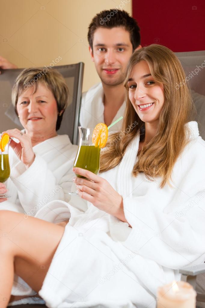 Wellness - People in Spa with Chlorophyll-Shake