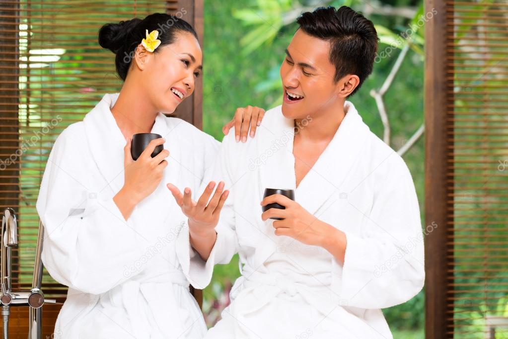 Indonesian Asian couple drinking tea in wellness spa