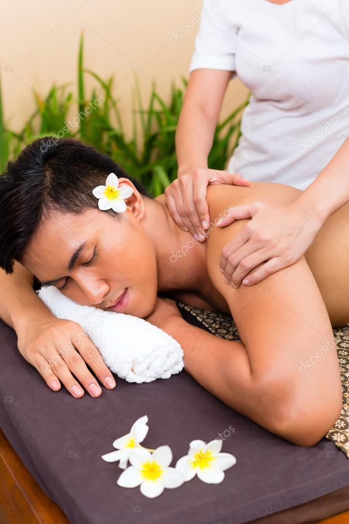 Indonesian Asian Man At Wellness Massage Stock Photo Indonesian Asian Man At Wellness Massage Stock Photo
