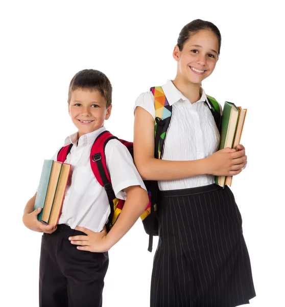 Dva šťastní studenti stojí s knihami v rukou — Stock fotografie