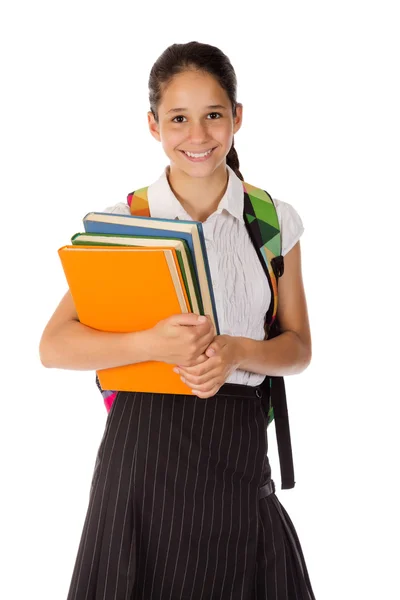 Happy schoolgirl standing with book in hands — Stock Photo, Image