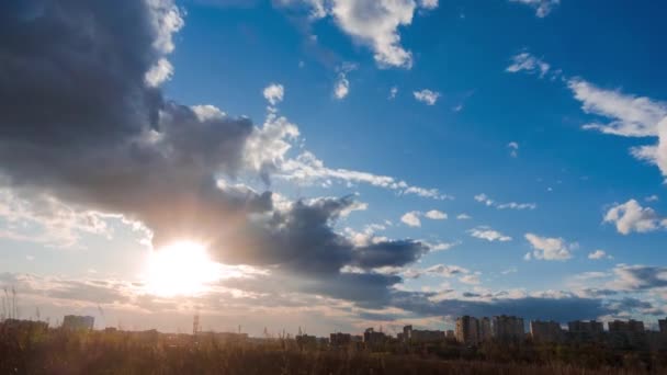 Timelapse of moving clouds at sunset with cityscape — Stock Video