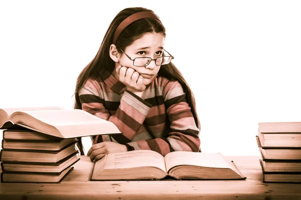 Chica triste con pila de libros viejos — Foto de Stock