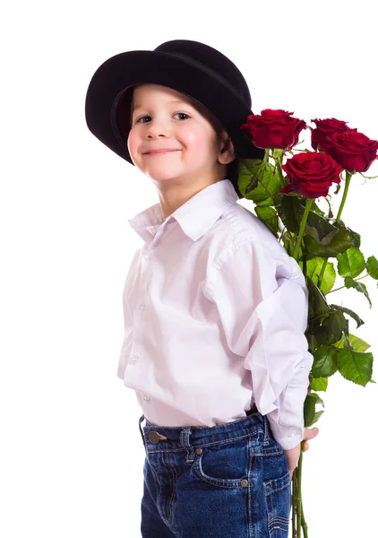 Mały chłopiec z czerwonych róż — Zdjęcie stockowe