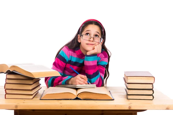 Dreaming girl with pile of books — Stock Photo, Image