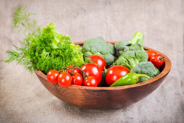 Vegetables on wooden plate — Stock Photo, Image