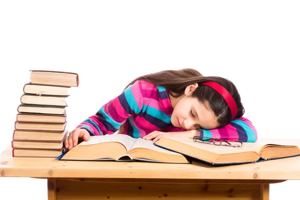 Chica cansada con pila de libros viejos — Foto de Stock