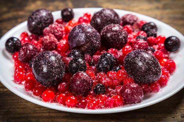 Close-up of frozen berries in plate — Stock Photo, Image